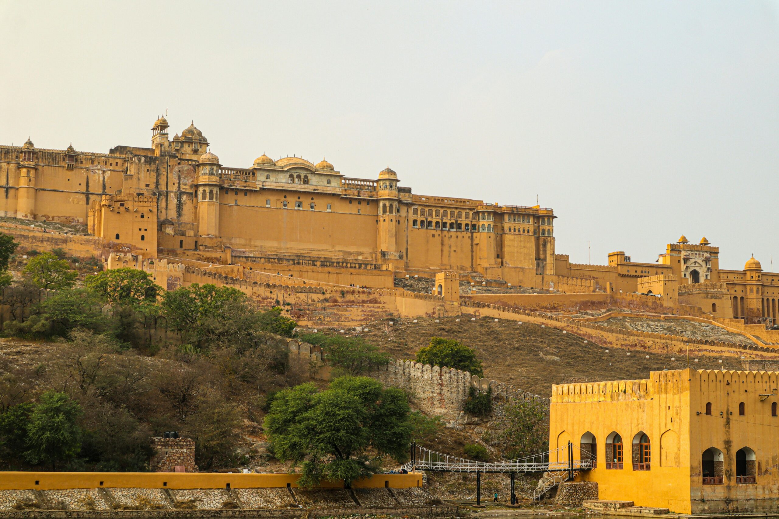 Scenic view of the Amer Fort in Jaipur, India, capturing its historic architecture in a warm daylight setting.